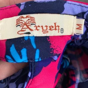 Bright purple, pink, and blue mini dress.